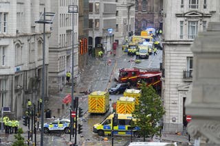 Police and emergency personnel dealing with a road traffic accident on Water Street near the Liver Building in Liverpool after a car collided with pedestrians during the Premier League winners parade
